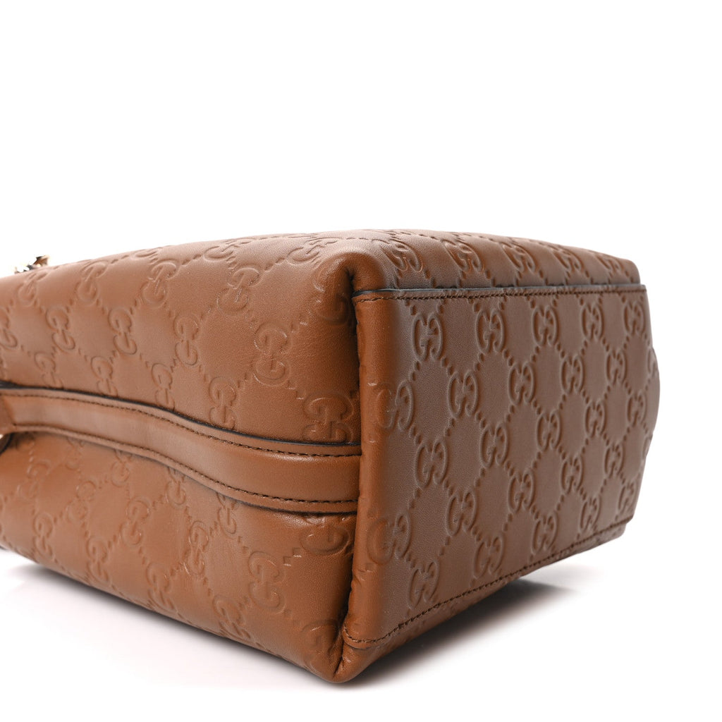 GG Calfskin Embossed Emblem Small Bucket Bag Brown
